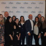 business professionals stand for photo at the Long Island Hospitality Association 2018 kick off meeting