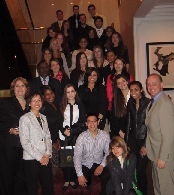 group of LIHA members pose for photo on staircase