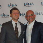 Anthony Melchiorri takes picture with business professional at the Long Island Hospitality Association 2018 kick off meeting